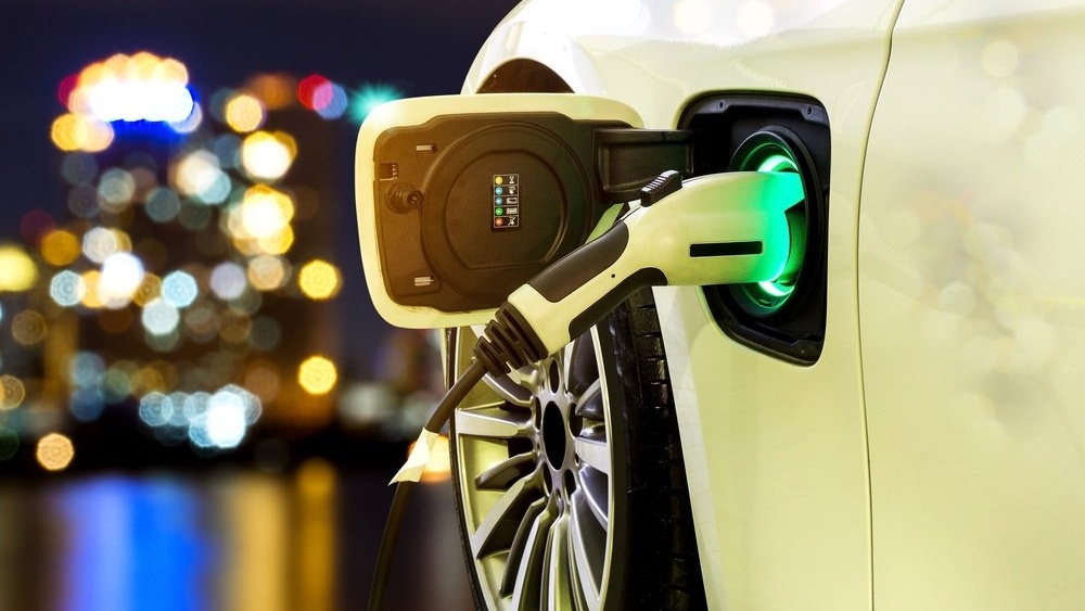 Electric Vehicle (EV) Charging in Front of Cityscape